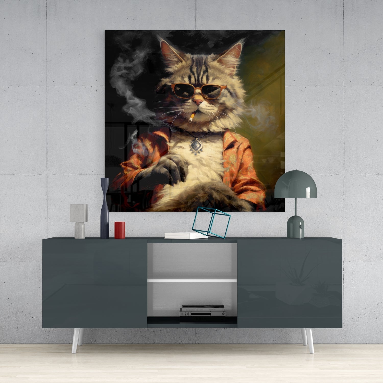 Cool cat wearing sunglasses and orange jacket displayed above gray media console in modern interior setting.