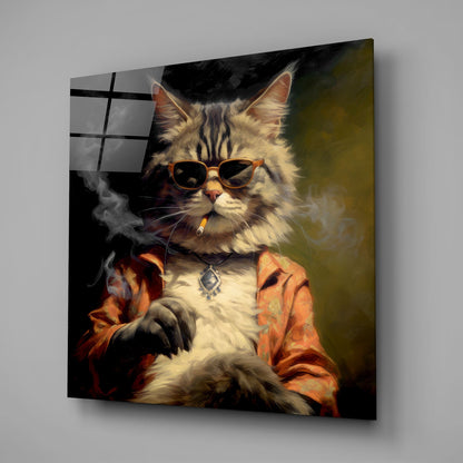 Fluffy white cat wearing brown sunglasses and orange jacket with cigarette, displayed on angled glass wall art against gray background.