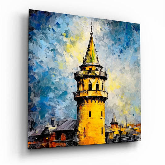 Angled perspective of glass wall art depicting a golden yellow tower with spiral balconies against a textured blue and white sky, painted in palette knife style.