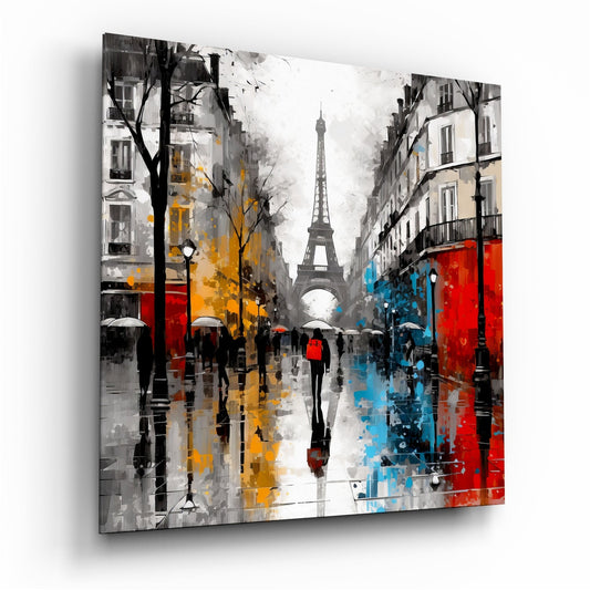 Angled view of a glass wall art panel depicting a rainy Parisian street with the Eiffel Tower, featuring red, yellow, and blue accents on buildings.