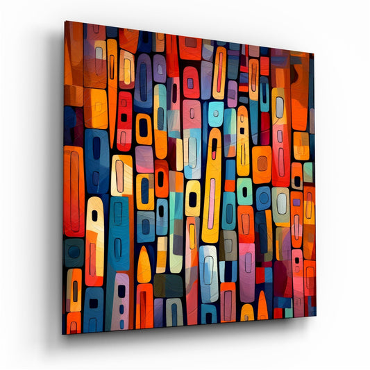 Angled perspective view of colorful mosaic glass wall art featuring stacked rectangular blocks in orange, red, blue, yellow, and teal tones with black outlines.