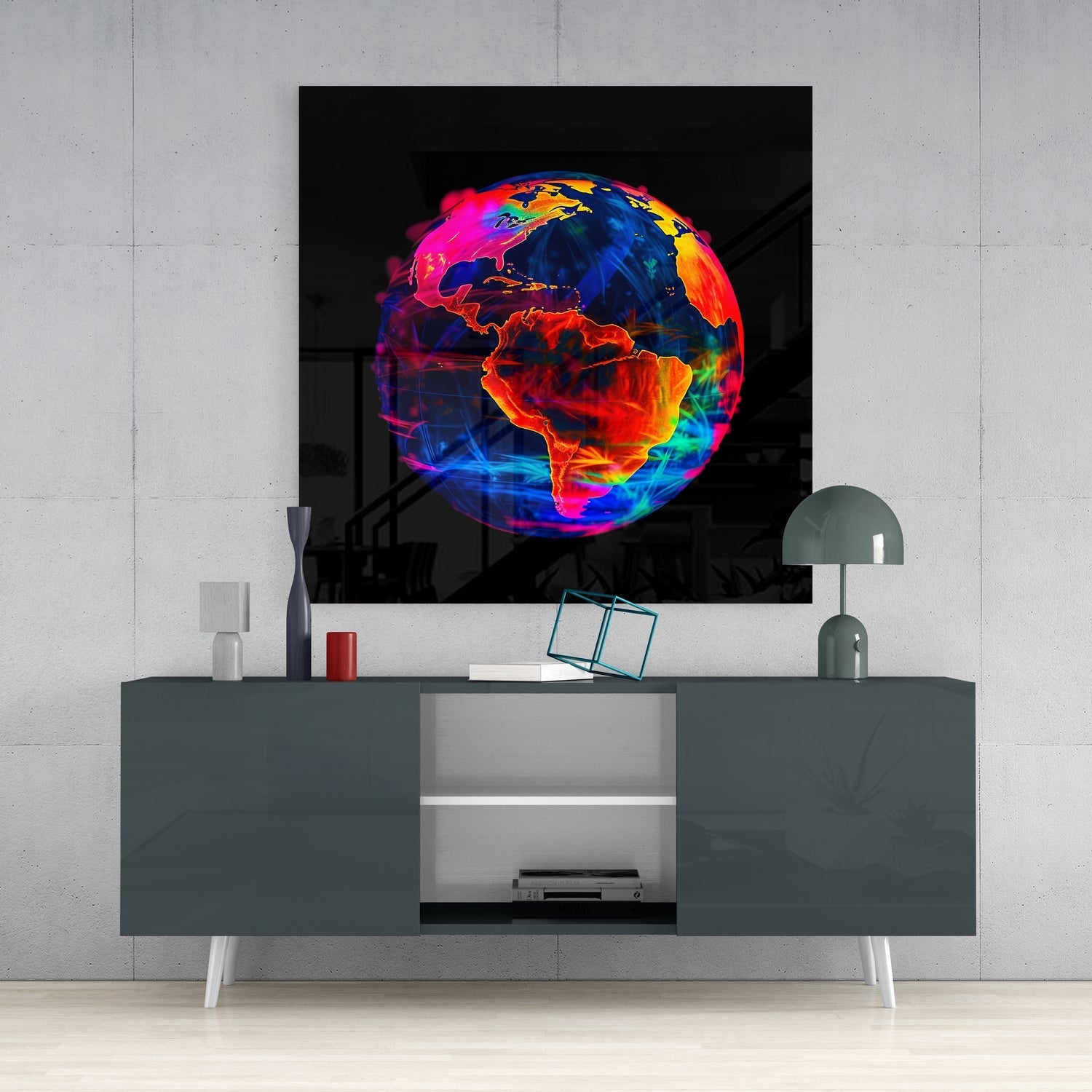 Vibrant neon Earth glass wall art displaying colorful continents in reds, oranges, blues, and greens mounted above a gray console table.