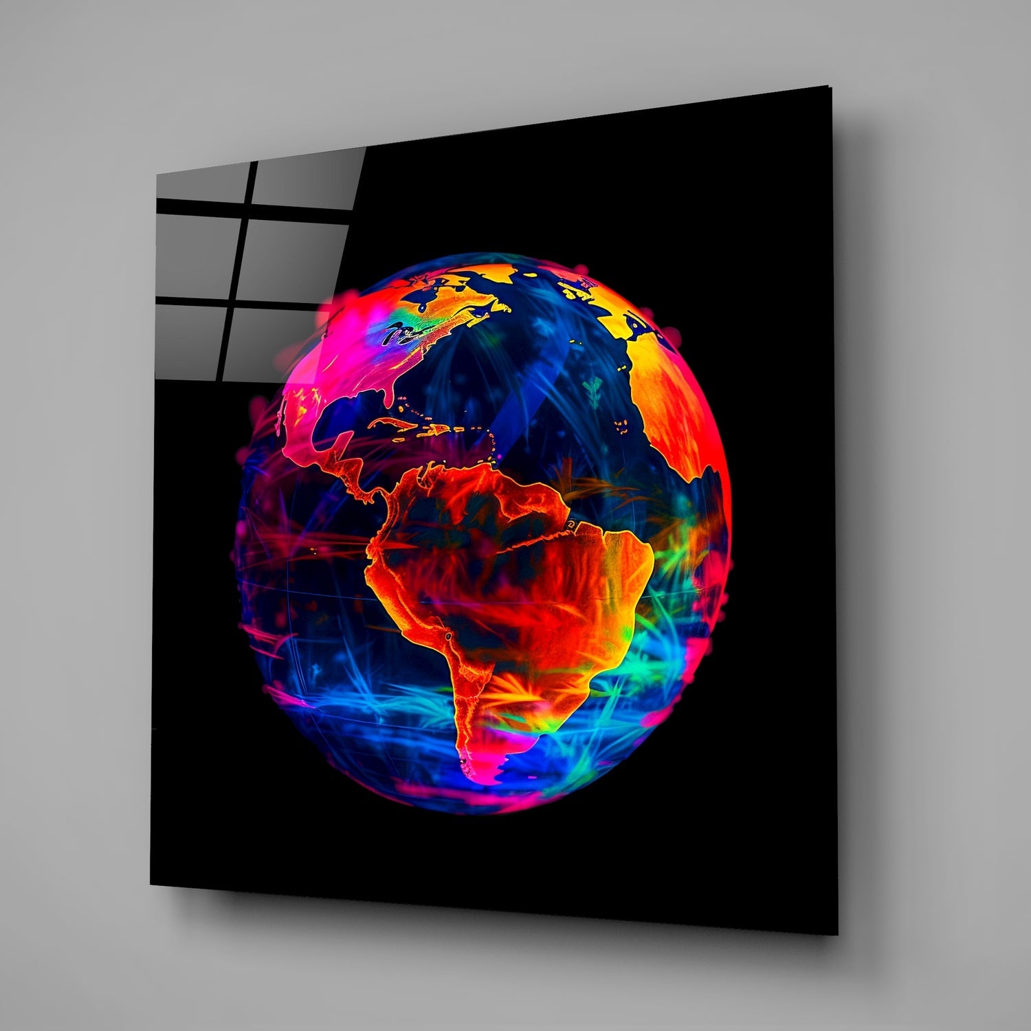 Neon Earth Glass Wall Art displayed at an angle showing a vibrant globe with glowing red, orange, blue, and magenta continents against a black background.