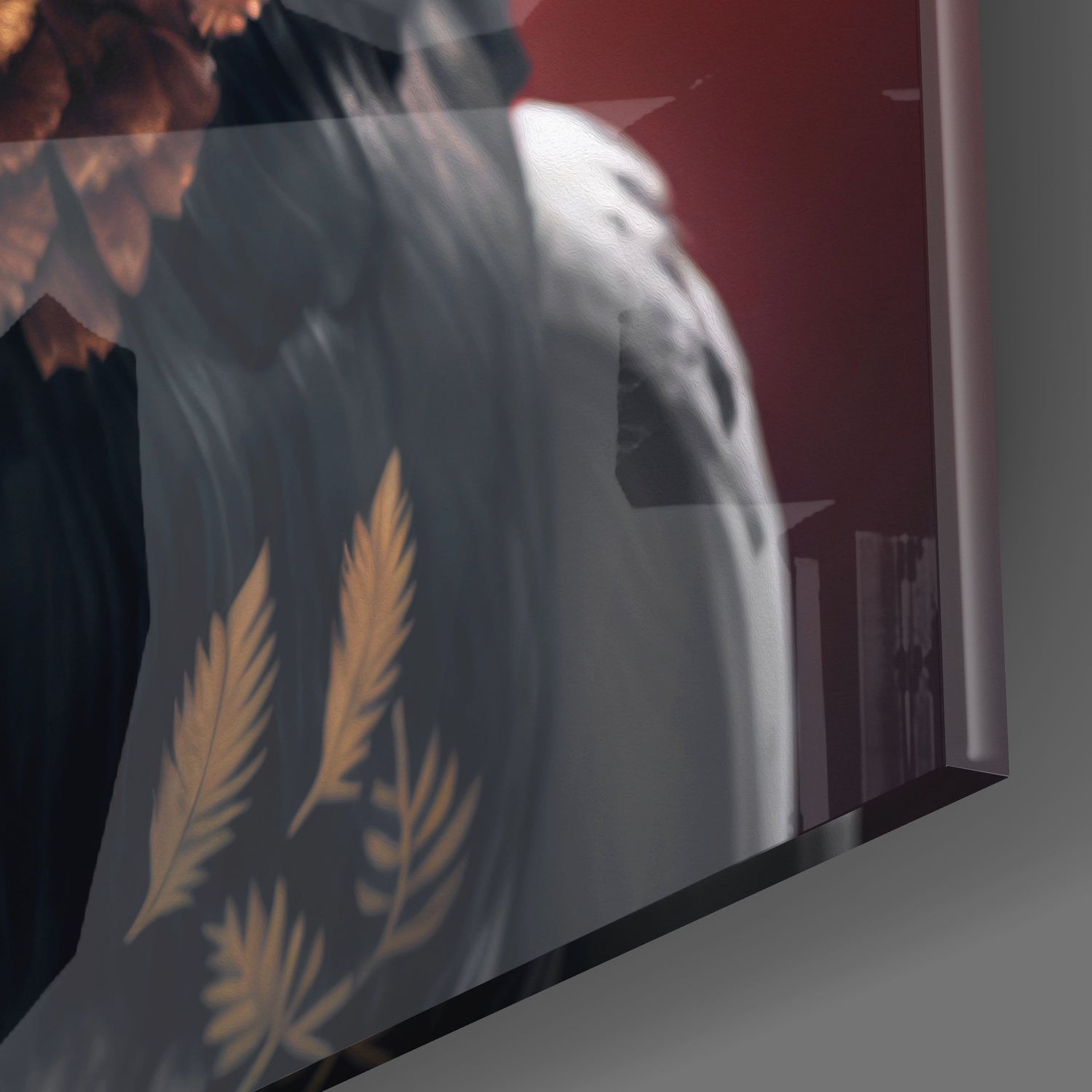 Close-up angled view of frosted glass panel displaying gold eagle wing designs with burgundy wall backdrop visible through transparent sections.