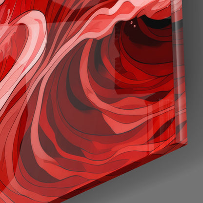 Close-up detail of layered red glass art showing translucent wave patterns with varying red and pink tones against gray background.