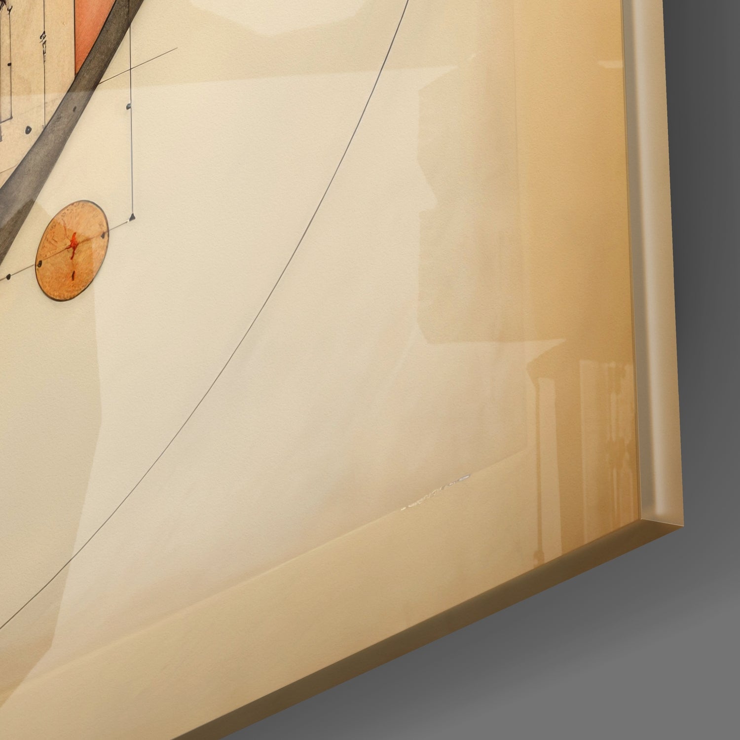 Close-up angled view of glass wall art panel with suspended wooden disc ornament and metal rod, cream and tan tones.