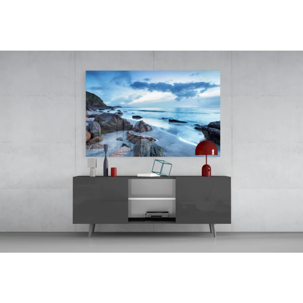 Coastal glass wall art above gray console table