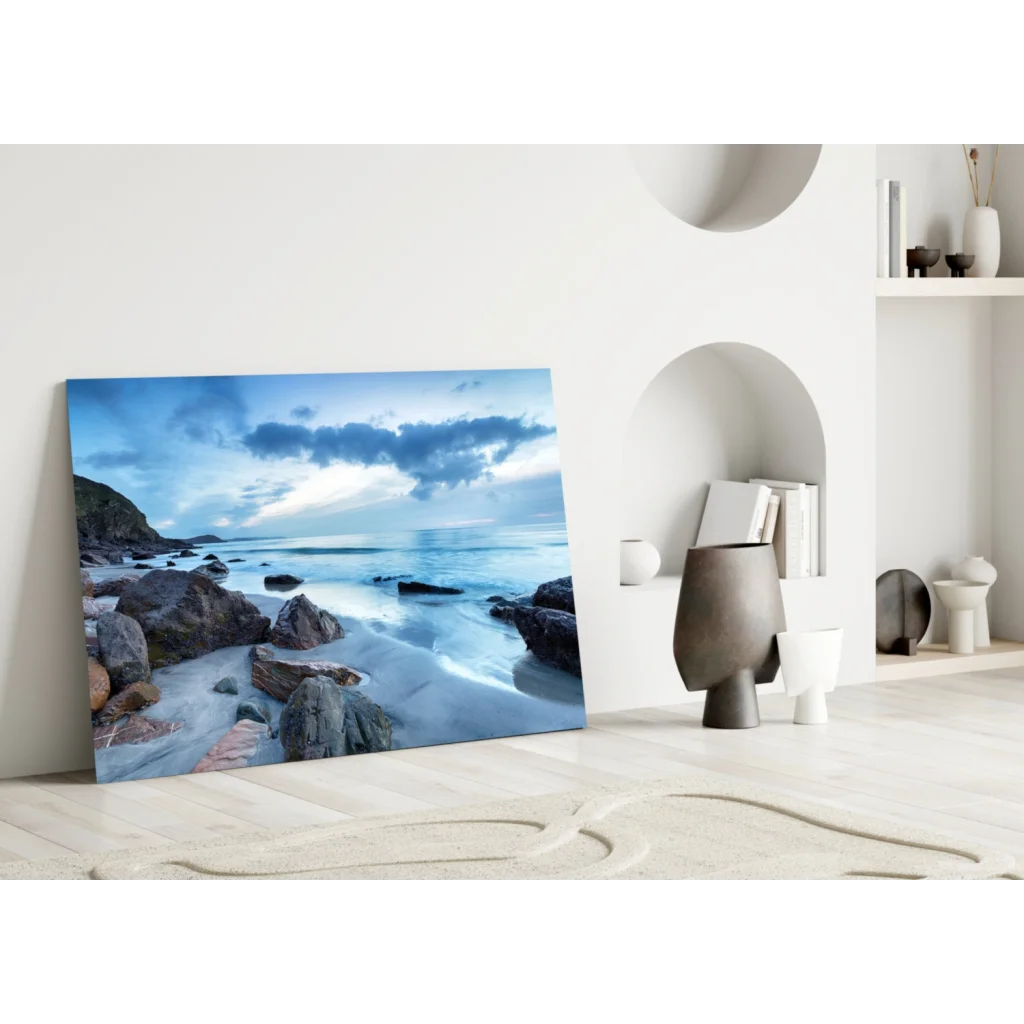 Stunning blue coastal glass wall art leaning on white wall