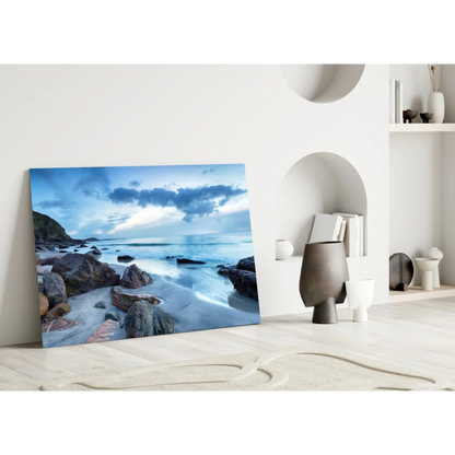 Stunning blue coastal glass wall art leaning on white wall