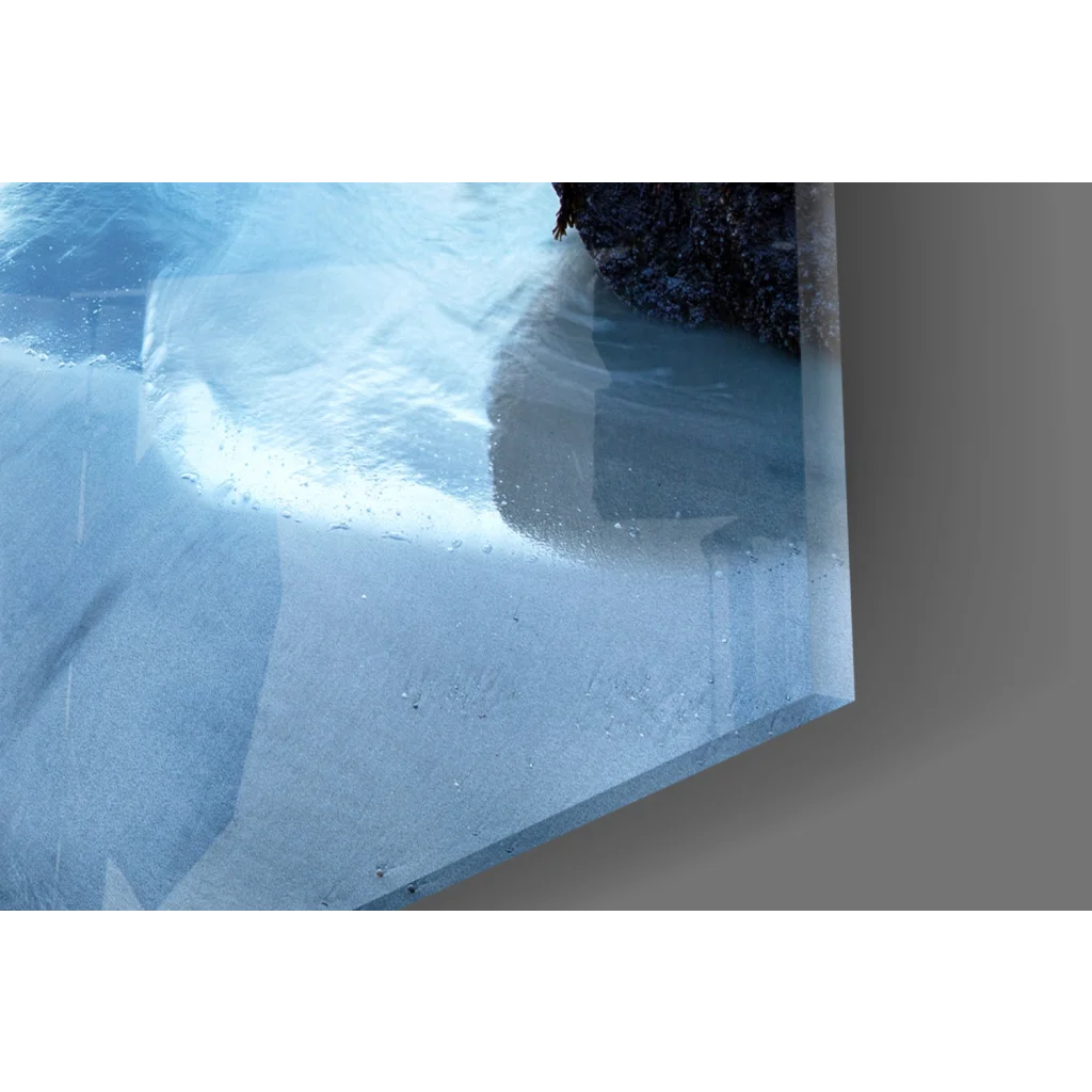 Stunning blue coastal glass wall art with submerged rock and glitter