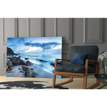 Stunning blue coastal glass wall art leaning on gray paneled wall