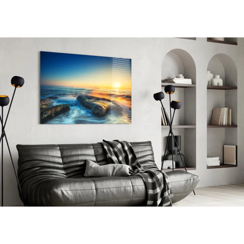 Vibrant sunset ocean waves on sleek glass wall art with golden sky