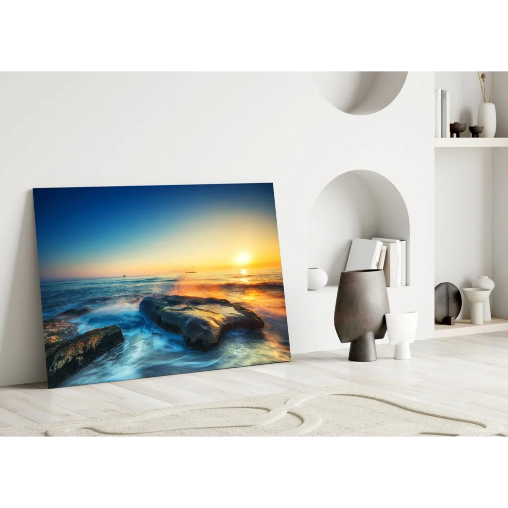Vibrant sunset ocean waves glass wall art with golden sky and textured rocks