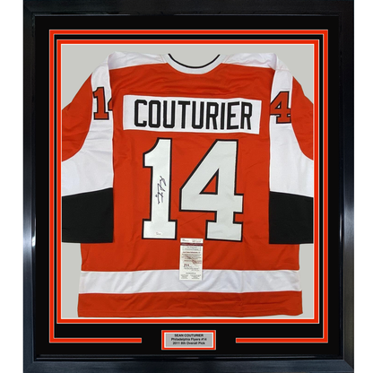Framed orange and white Philadelphia Flyers jersey number 14 with "COUTURIER" nameplate and JSA authentication certificate visible.
