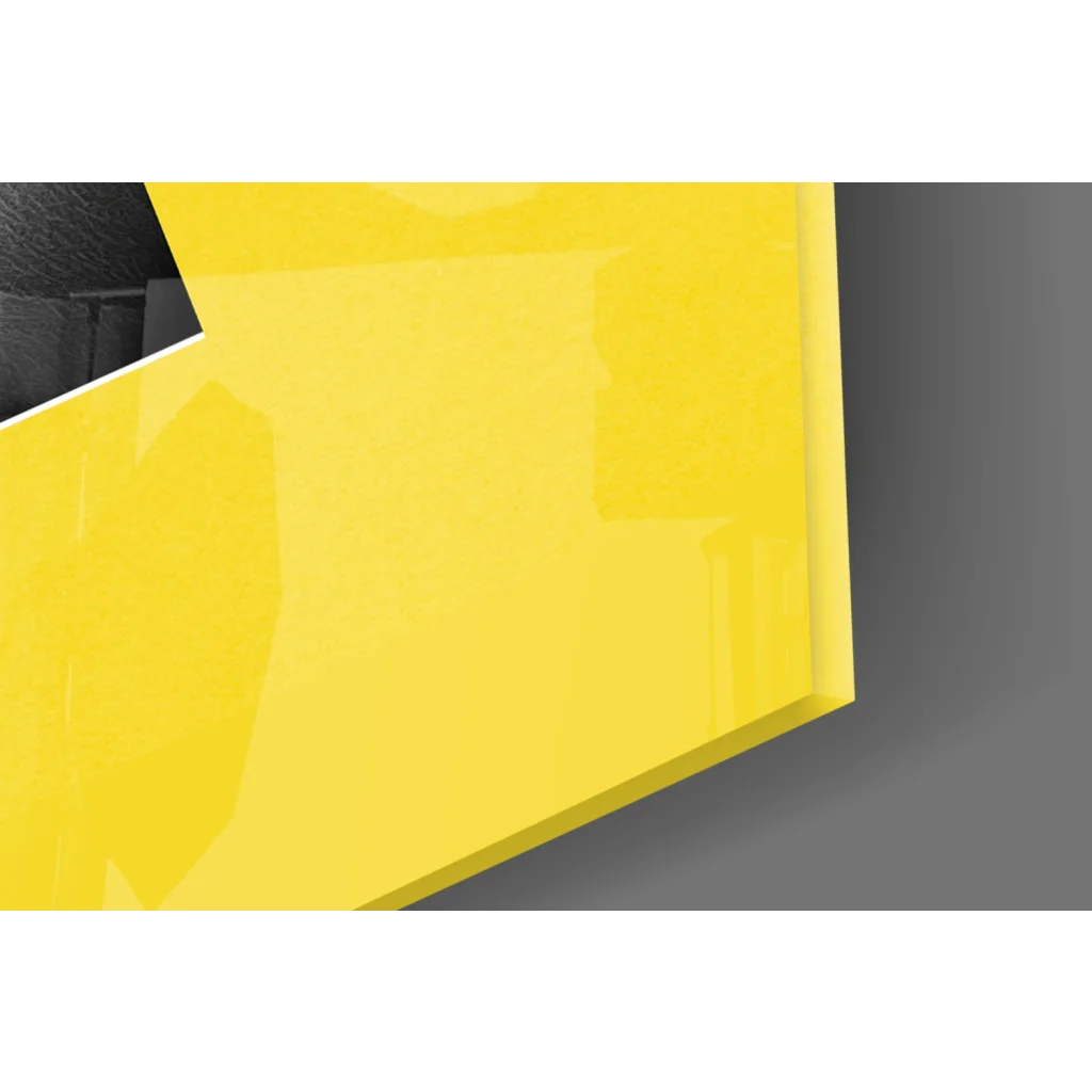 Bold yellow glossy glass wall art with sharp edges and reflective surface