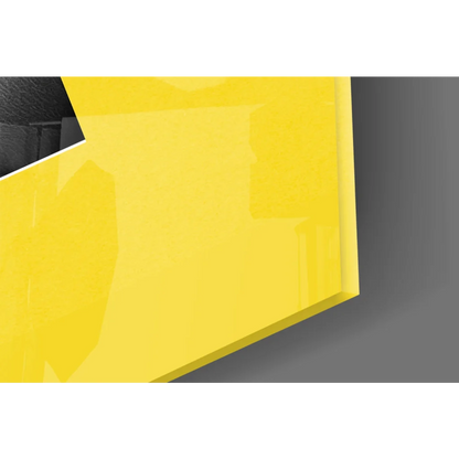 Bold yellow glossy glass wall art with sharp edges and reflective surface