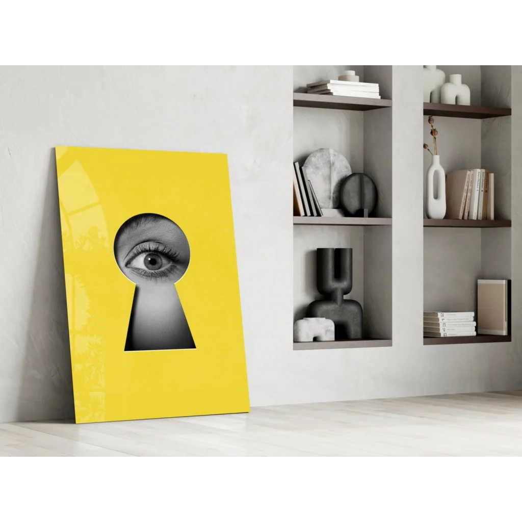 Vibrant yellow canvas keyhole eye glass wall art with bold black-and-white gaze