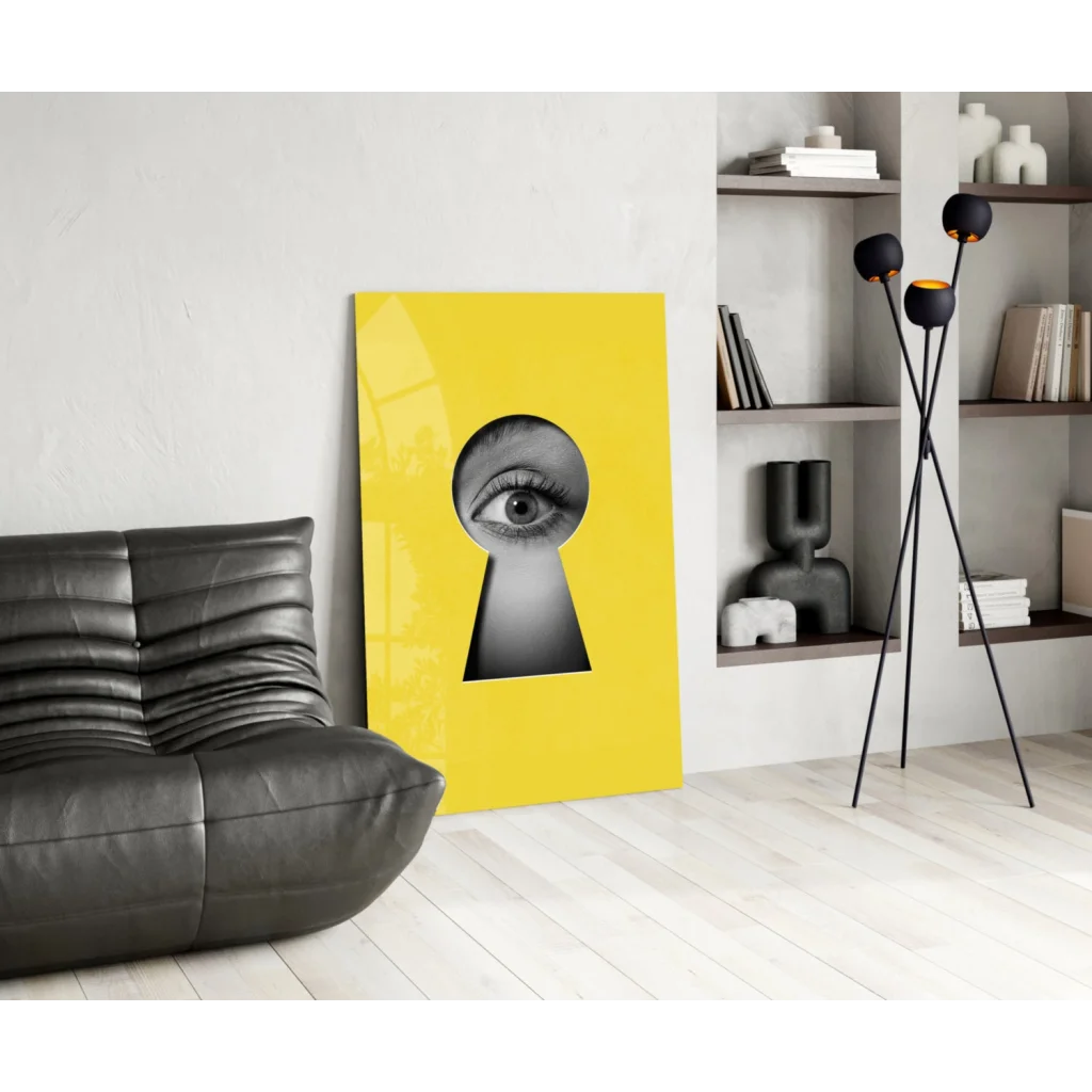 Vibrant yellow canvas keyhole eye glass wall art with bold black-and-white eye