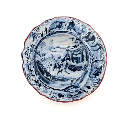 Blue and white ceramic soup plate with ruffled red rim from Seletti Classic Arabian set