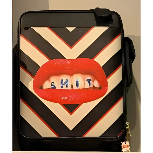 Seletti Toiletpaper travel kit with bold chevron pattern and red lips design