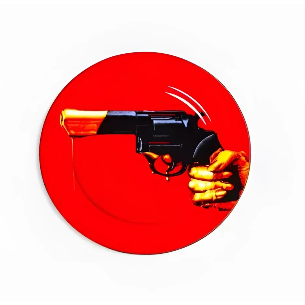 Seletti Wears ToiletPaper revolver porcelain plate with black revolver design on red background