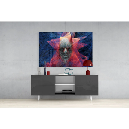 Vibrant glass wall art with abstract face in red-orange starburst on blue
