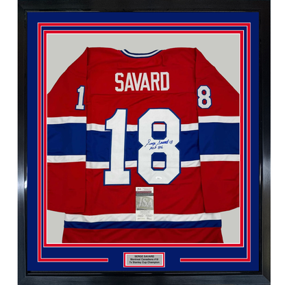 Framed Montreal Canadiens red, white, and blue hockey jersey number 18 signed by Serge Savard with HOF 86 inscription and authentication certificate.