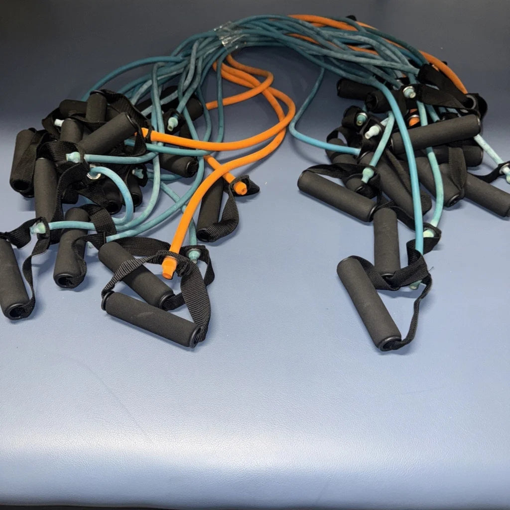 Tangled set of 18 resistance bands with handles in teal, orange, blue