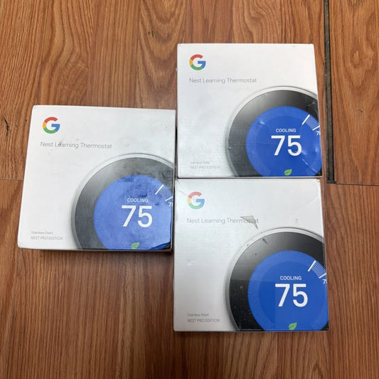 Three Google Nest Learning Thermostat Pro stainless steel boxes displaying cooling 75