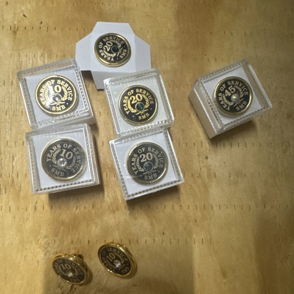 Set of 8 gold tone employee award pins for 10-45 years service in boxes
