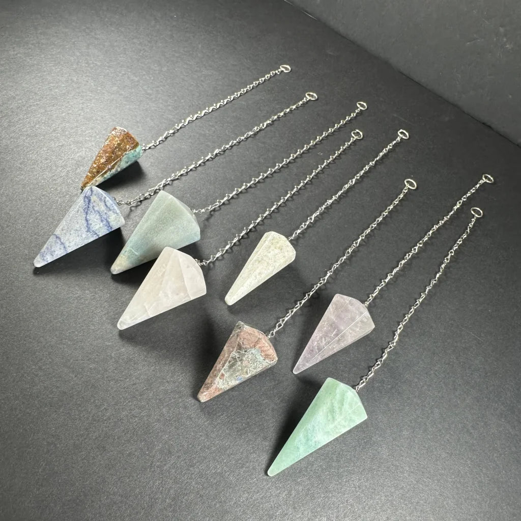 Seven natural stone pendulum set in blue-green hues with silver chains