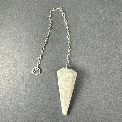 Light beige speckled stone pendulum on silver chain from Seven set