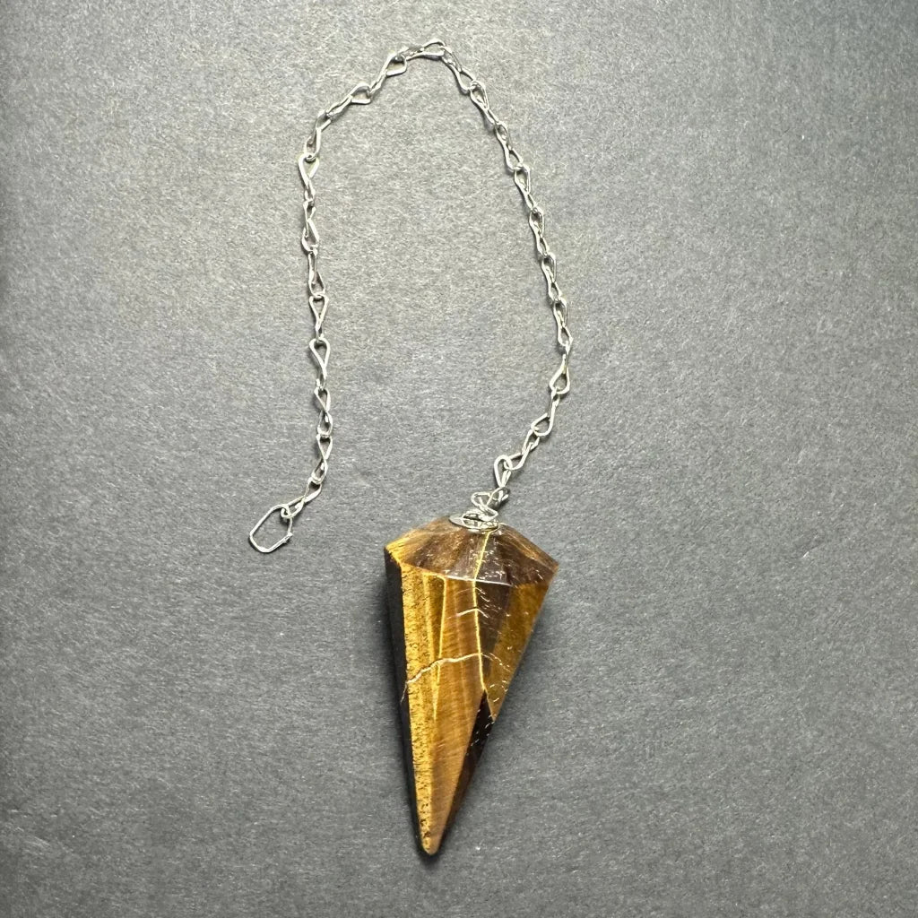 Golden-brown tiger eye stone pendulum on silver chain