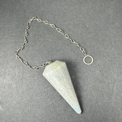 Light gray faceted stone pendulum with blue tip on silver chain