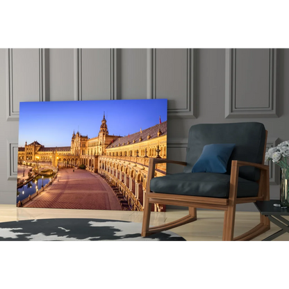 Illuminated Plaza de España Seville glass wall art at twilight
