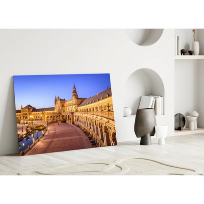 Illuminated Plaza de España Seville glass wall art at twilight
