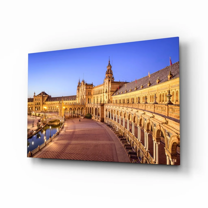 Golden-hued Plaza de España Seville glass wall art at twilight