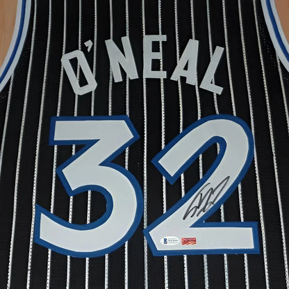 Shaq signed deluxe framed jersey with black white stripes and ONeal 32 in blue