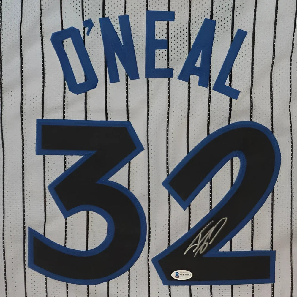 Back of a white pinstripe custom jersey with blue and black lettering featuring the name o’neal and number 32