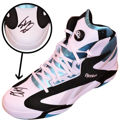 Autographed Reebok Shaq Attaq size 22 shoe with white, black, and light blue accents
