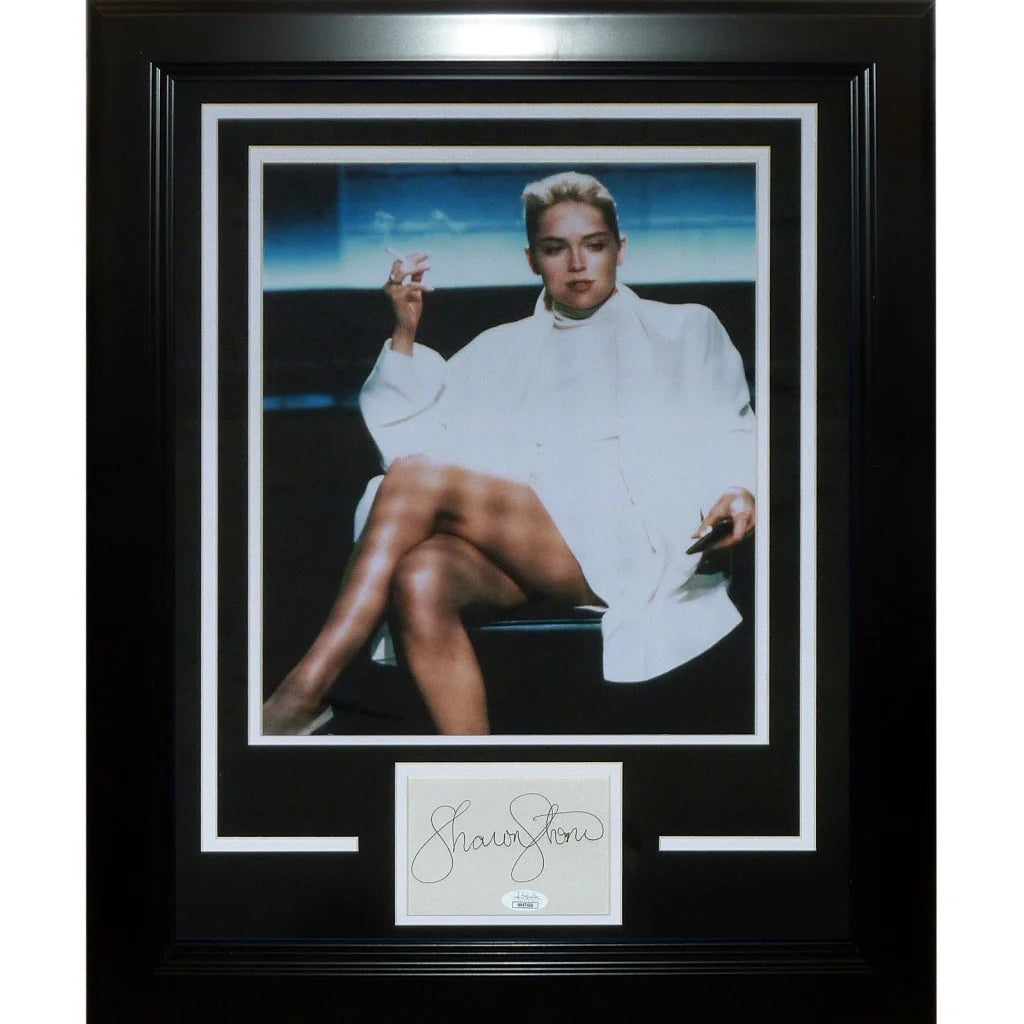Black framed deluxe 11x14 photo of sharon stone wearing a white coat autographed with signature and jsa certification