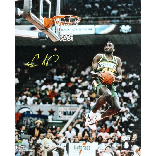 Shawn Kemp signed SuperSonics photo with authentic Beckett authentication showing him mid-air dunk