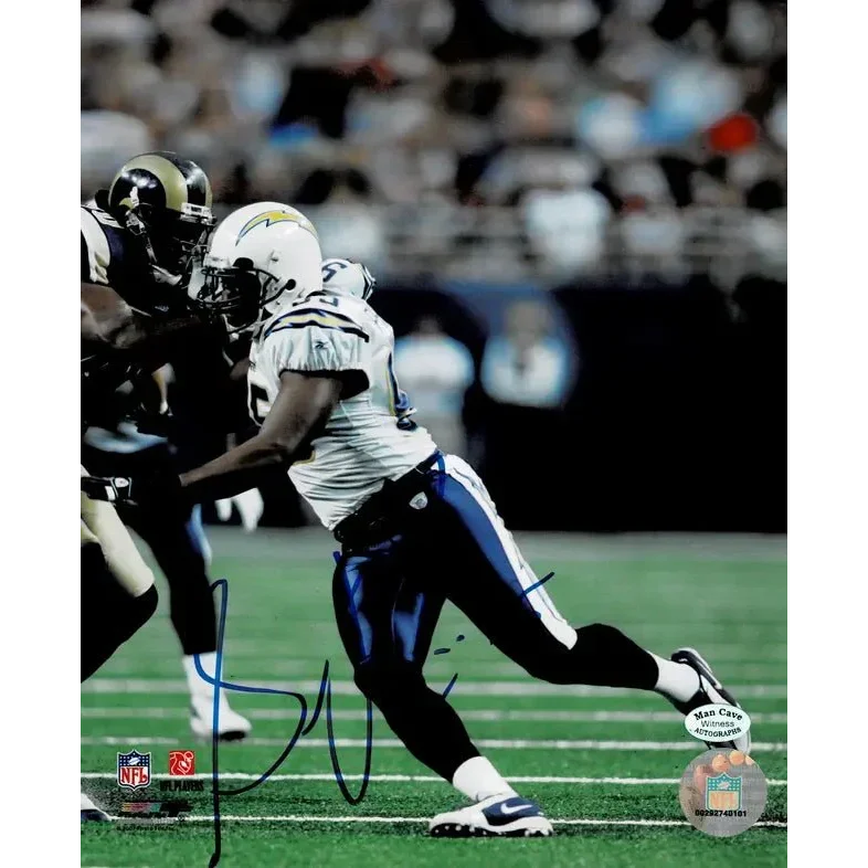 Autographed Shawn Phillips San Diego Chargers football photo on green field with COA