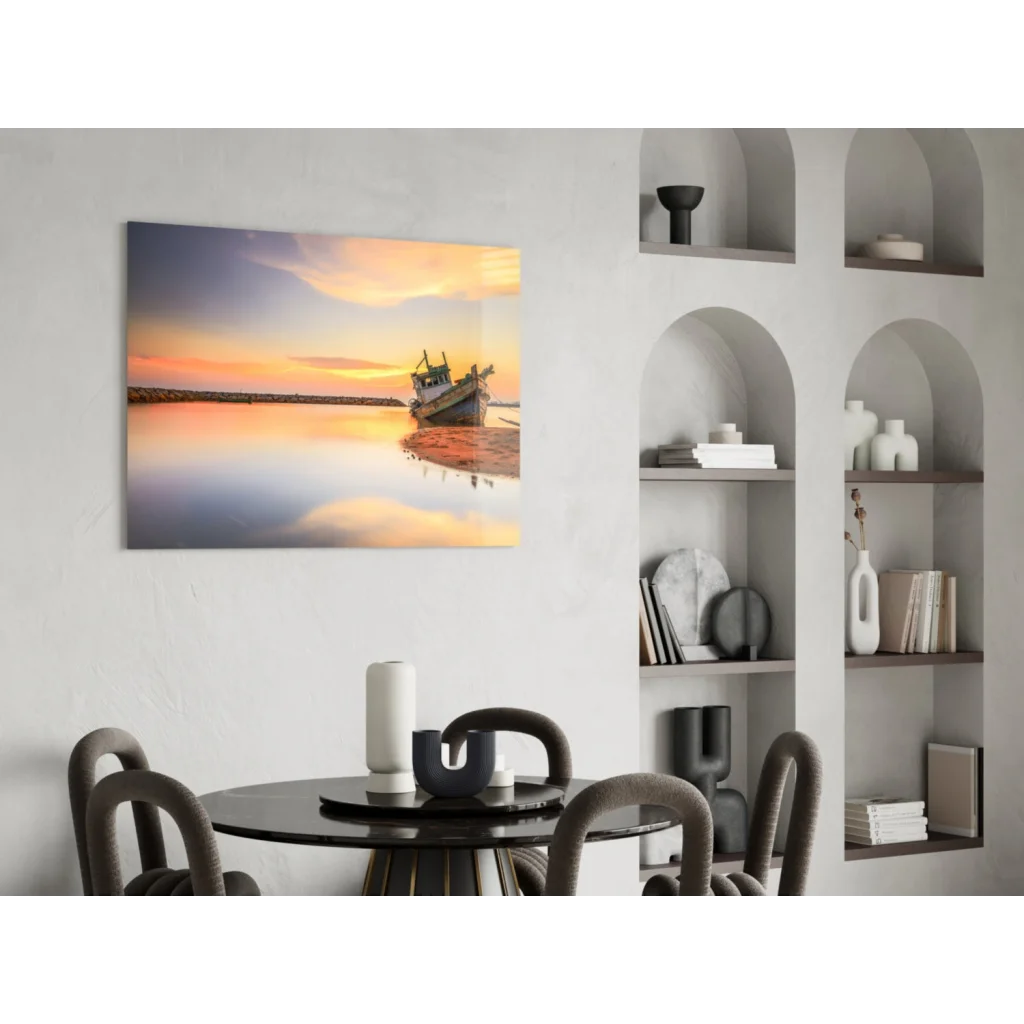 Serene sunset over water with fishing boat on shore, glass wall art print