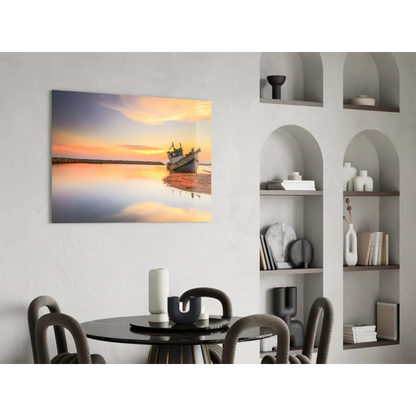 Serene sunset over water with fishing boat on shore, glass wall art print