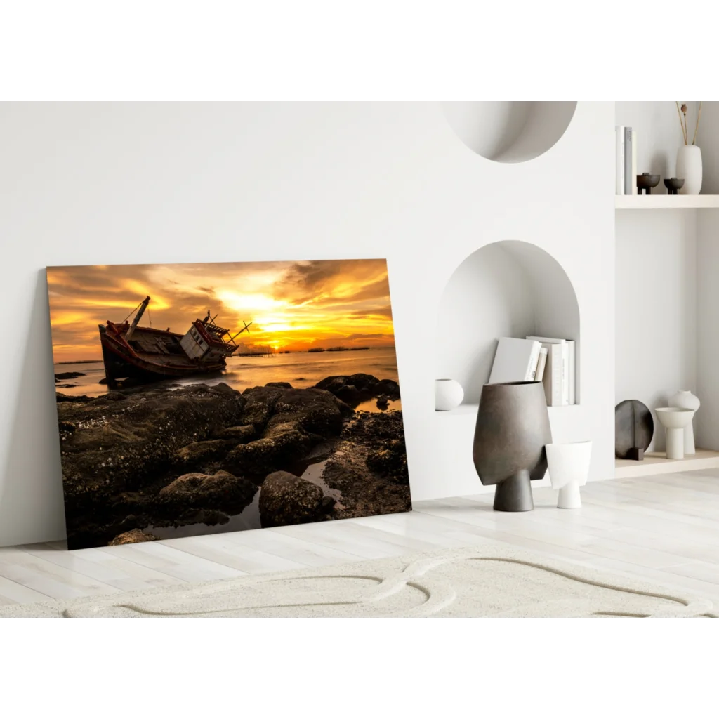 Dramatic sunset shipwreck glass wall art on rocky shores
