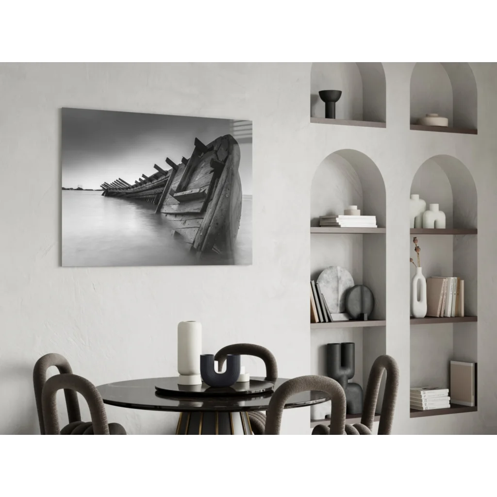 Stunning black-and-white glass wall art of weathered shipwreck boats on calm water