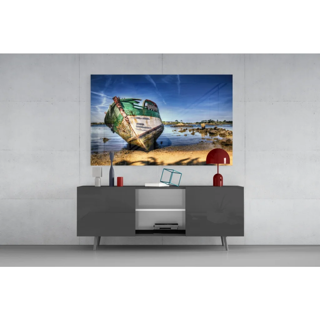 Weathered green boat on sandy shore glass wall art print