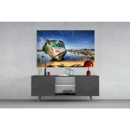 Weathered green boat on sandy shore glass wall art print