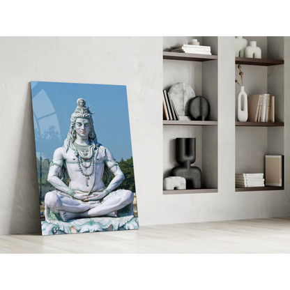 Serene Shiva glass wall art statue in white marble against blue sky